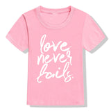 Love Never Fails Kids T-Shirt